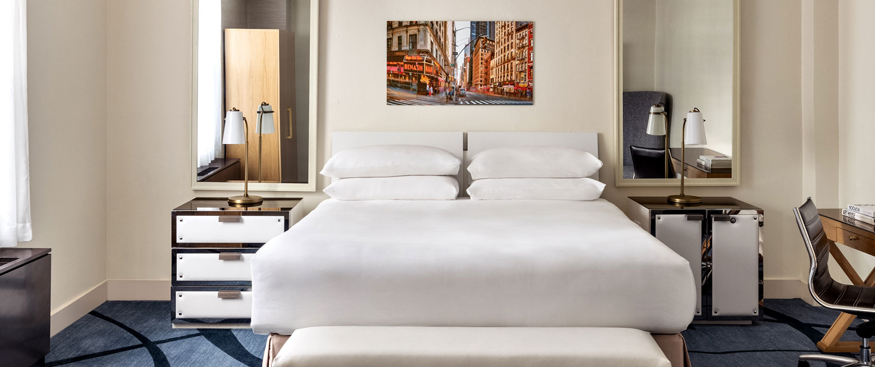 two queen beds in a guestroom at 70 park ave hotel